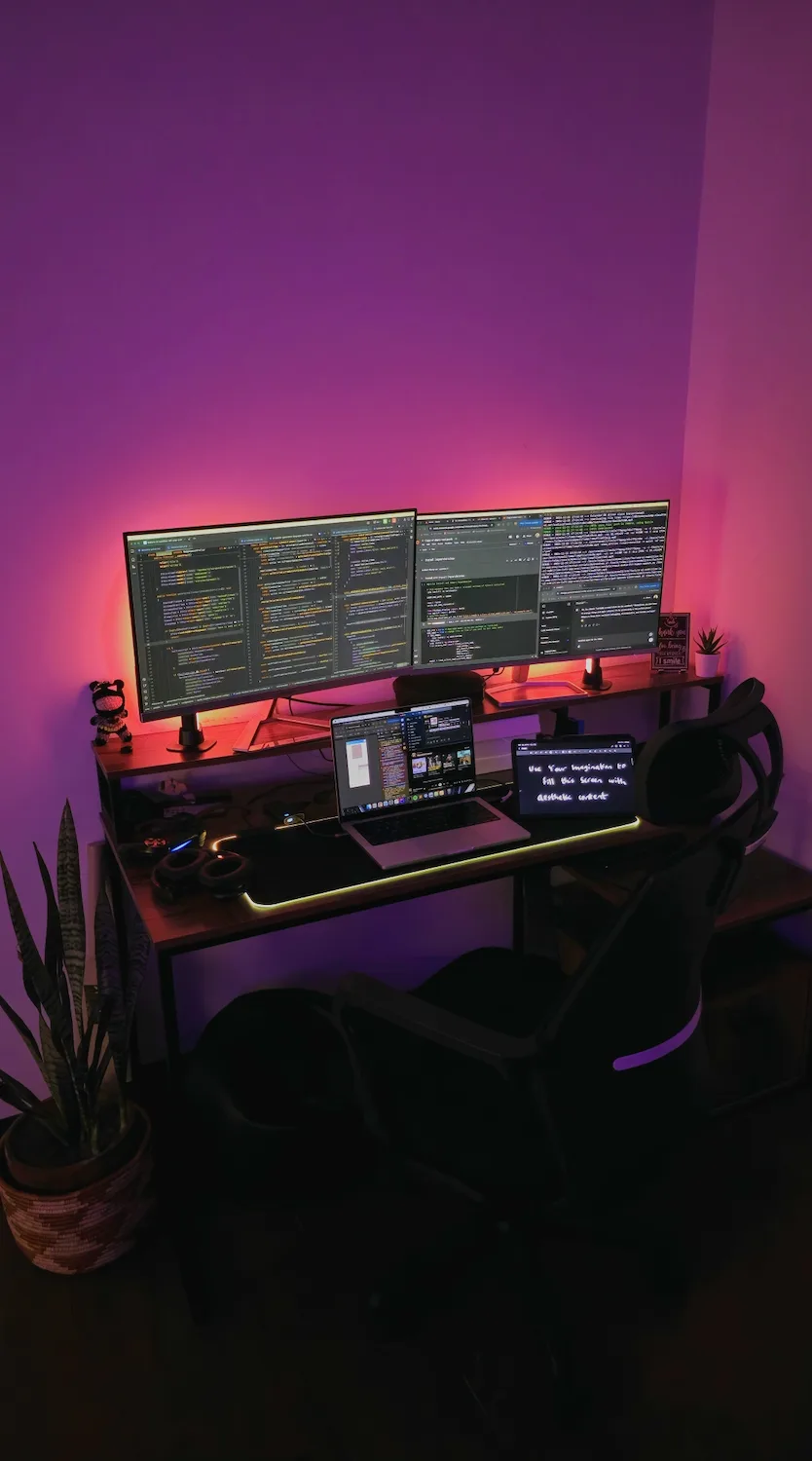 Taimur's desk: an ultrawide monitor, laptop and keyboard